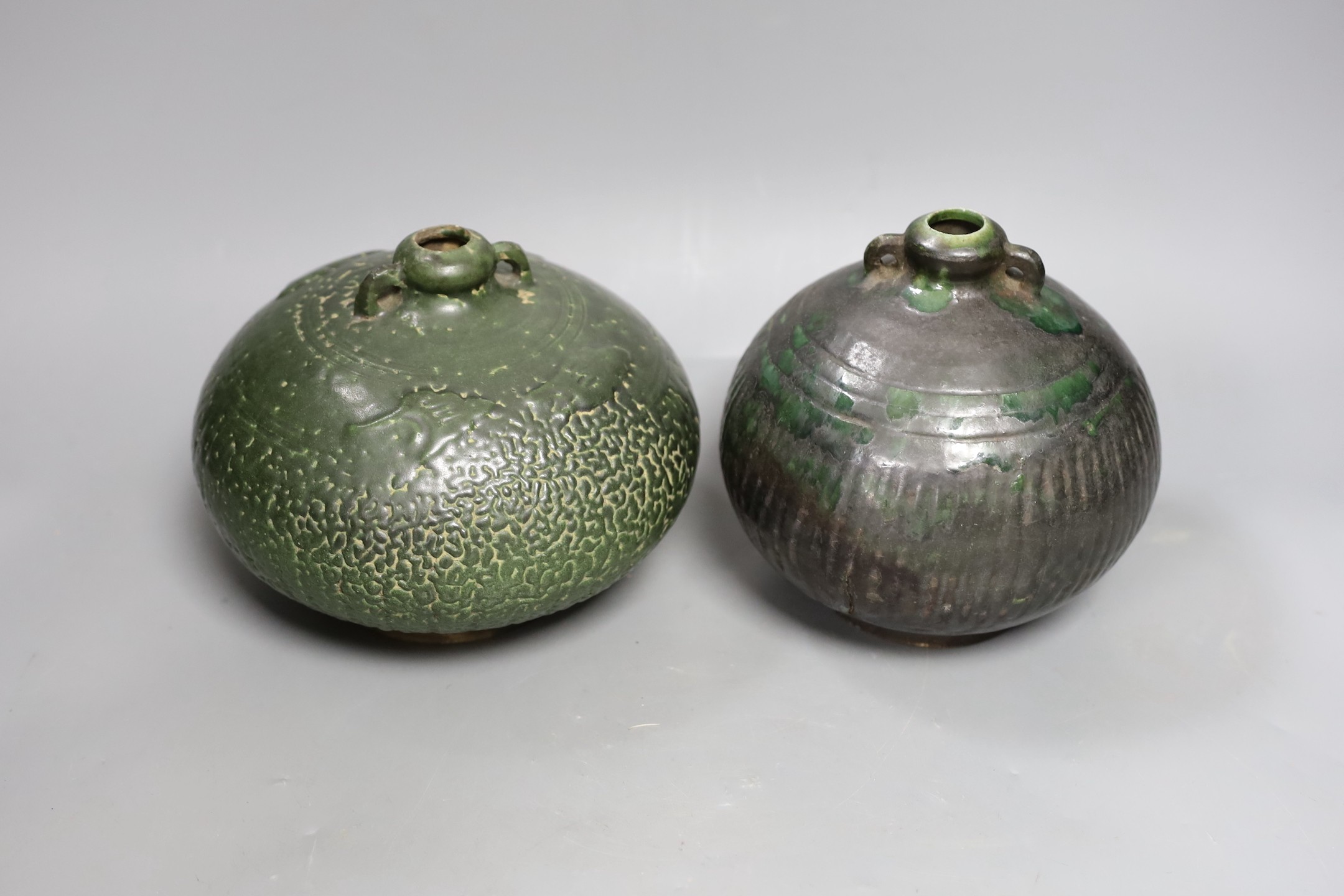 Two Thai Sawankhalok green-glazed ring handled jars, 15th-16th century, tallest 15.5cm